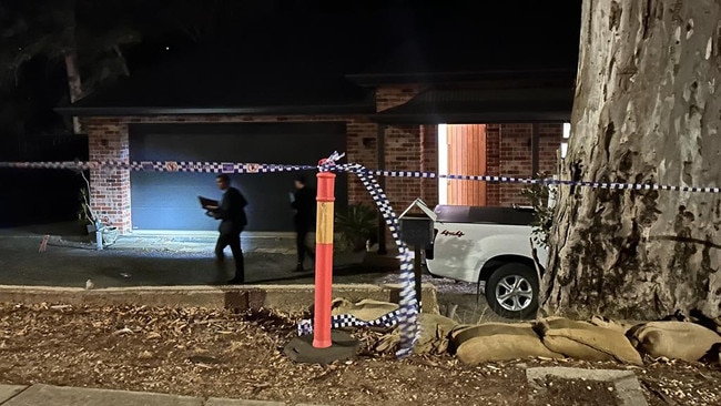 Police outside the Tea Tree Gully house after the stabbing. Picture: Natalie Vihkrov