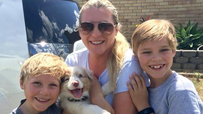 Kristy Durman and her two children with their dog, Bowie, who was allegedly stolen from their Southport home on Wednesday. Photo: Supplied.