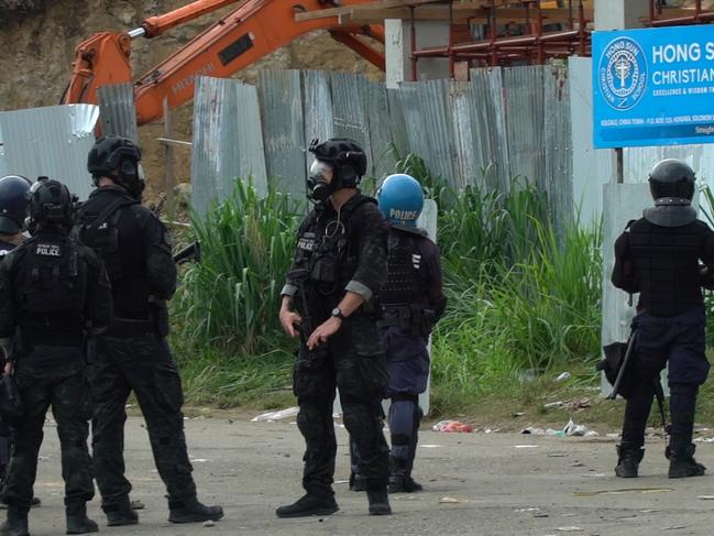 Australian Federal Police officers patrolling with local police in Honiara. Picture: Jay Liofasi/AFP