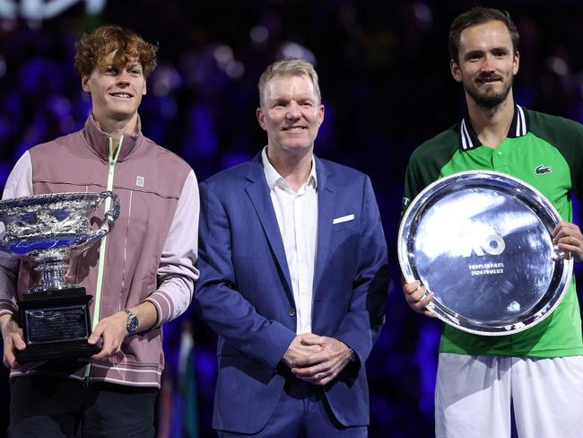 Jim Courier pictured with last year’s mens Australian Open finalists, Jannik Sinner and Daniil Medvedev Picture: AFP