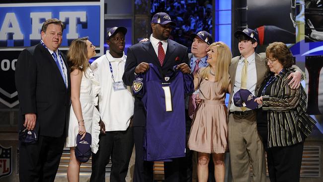 Baltimore Ravens draft pick Michael Oher poses for a photograph with his family. Photo by Jeff Zelevansky/Getty Images.