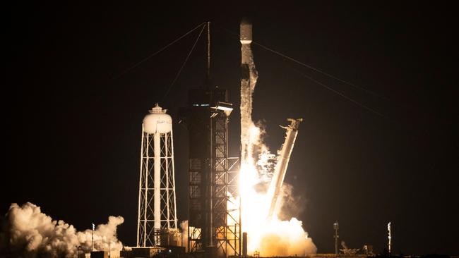 This NASA handout image shows a SpaceX Falcon 9 rocket launching with NASA's Imaging X-ray Polarimetry Explorer (IXPE) spacecraft onboard from Launch Complex 39A, December 9, 2021, at NASA's Kennedy Space Center in Florida. - The IXPE spacecraft is the first satellite dedicated to measuring the polarization of X-rays from a variety of cosmic sources, such as black holes and neutron stars. Launch occurred at 1:00 a.m. EST. (Photo by Joel KOWSKY / NASA / AFP) / RESTRICTED TO EDITORIAL USE - MANDATORY CREDIT "AFP PHOTO / NASA / JOEL KOWSKY " - NO MARKETING - NO ADVERTISING CAMPAIGNS - DISTRIBUTED AS A SERVICE TO CLIENTS