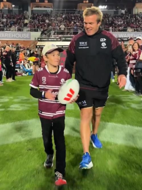 SJ delivered the gameball with Jake Trbojevic. Picture: Sea Eagles