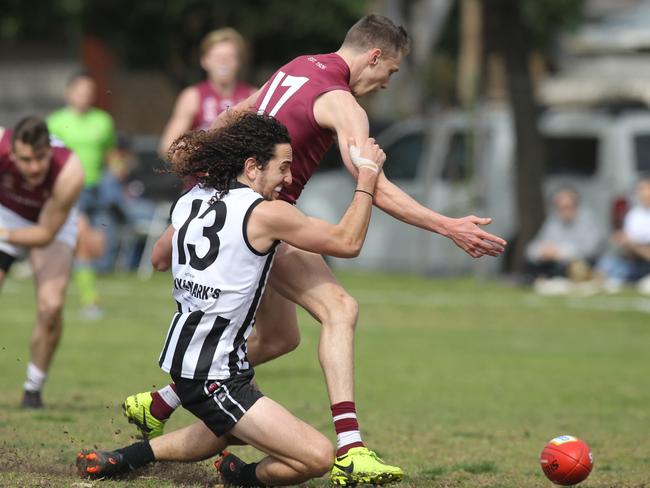 PAOC's Jake Pitt is tackled by PNU's Dylan Auciello during Saturday’s semi-final Picture: AAP/Dean Martin