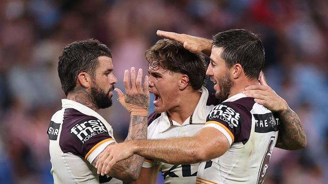 SYDNEY, AUSTRALIA - MARCH 06: AdamÃÂ Reynolds, Ben Hunt and Reece Walsh of the Broncos celebrate winning the round one NRL match between Sydney Roosters and Brisbane Broncos at Allianz Stadium on March 06, 2025, in Sydney, Australia. (Photo by Cameron Spencer/Getty Images)