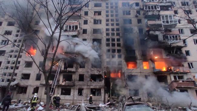 Rescuers work next to a Kyiv residential building damaged by shelling, as Russia's attack on Ukraine continues. Moody’s cited credit risks are global and not ring-fenced within Russia and its close ally Belarus and target Ukraine. Picture: State Emergency Service of Ukraine / Reuters