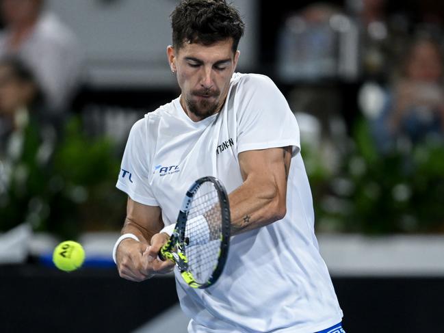 ADELAIDE, AUSTRALIA - JANUARY 06: Thanasi Kokkinakis of Australia  plays a backhand  in his match against Yoshihito Nishioka of Japan during day one of the 2025 Adelaide International at Memorial Drive on January 06, 2025 in Adelaide, Australia. (Photo by Mark Brake/Getty Images)