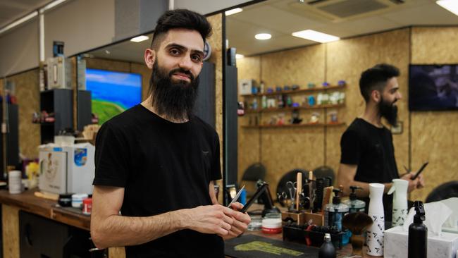 Barber Adam Zahroon at his Stanmore shop. The Director of Students at Newington College is sending students with unruly haircuts to him. Picture: Justin Lloyd