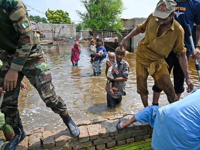 Pakistan faced heavy monsoon rains killing more than 1,200 people and leaving almost a third of the country under water. (Photo by Aamir QURESHI / AFP)