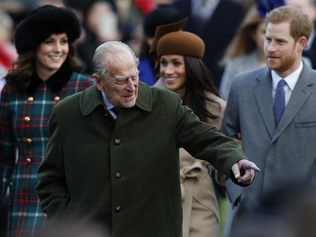 Prince Philip, centre, with Kate (left), Meghan and Harry in 2017. Picture: AFP