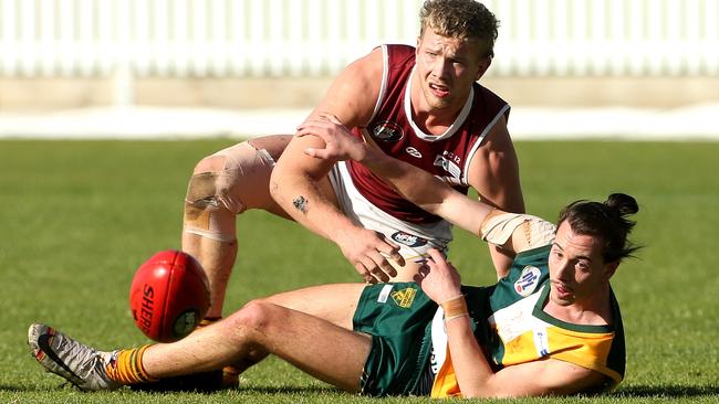 Tom Keys and Alexander Phokos battle for the ball. Picture: Hamish Blair