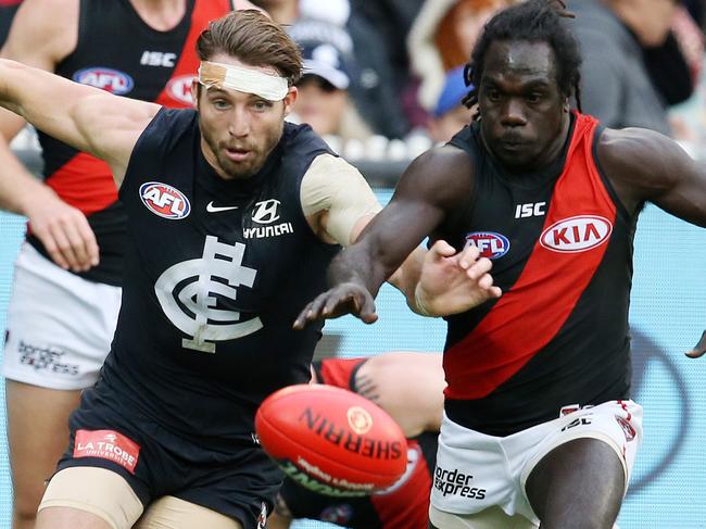 AFL Round 8. 12/05/2018.  Carlton v Essendon at the MCG.  Carlton's Dale Thomas and Essendon's Anthony McDonald-Tipungwuti   . Pic: Michael Klein