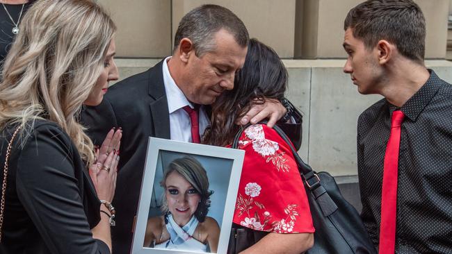 Family and supporters of the murdered mother wore red to help raise awareness of violence against womena and children. Picture: Jason Edwards