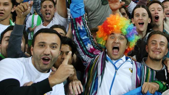 Fans get into the spirit during their team’s triumph in Melbourne.