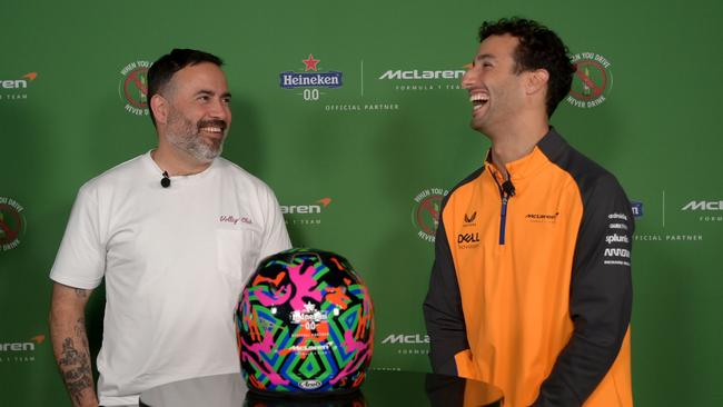 Artist Reko Rennie and Daniel Ricciardo share a laugh.