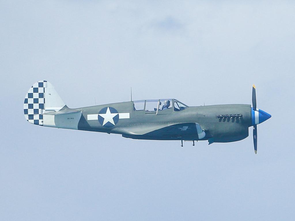 A P-40 Kittyhawk during the inaugural Pacific Airshow over Surfers Paradise on the Gold Coast. Picture: Glenn Campbell