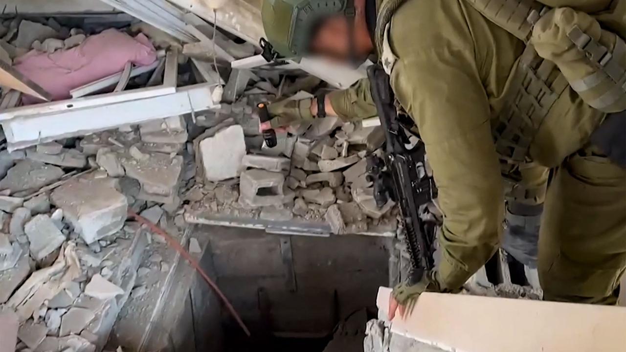 An Israeli soldier checks the entrance to a tunnel used by the Palestinian Hamas movement in the Gaza Strip. Picture; AFP. 