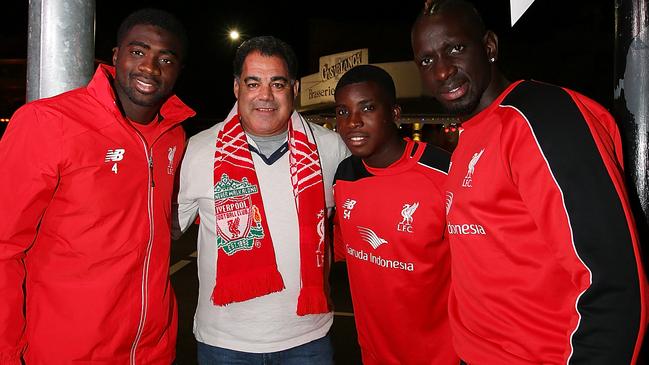 BRISBANE, AUSTRALIA - JULY 16: Queensland Rugby League legend and Liverpool FC fan Mal Meninga with Liverpool FC players (L-R) Kolo Toure, Sheyi Ojo and Mamadou Sakho at the renaming of Caxton st as Anfield Road to celebrate the arrival of Liverpool FC on July 16, 2015 in Brisbane, Australia. Liverpool FC are in Queensland to play the Brisbane Roar at Suncorp Stadium on the first leg of their Australian tour (Photo by Chris Hyde/Getty Images for Tourism Queensland)