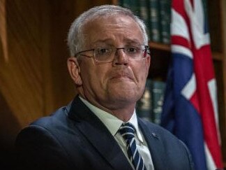 Scott Morrison white-knuckled his way through a press conference after the first interest rates rise in a decade. Picture: Jason Edwards