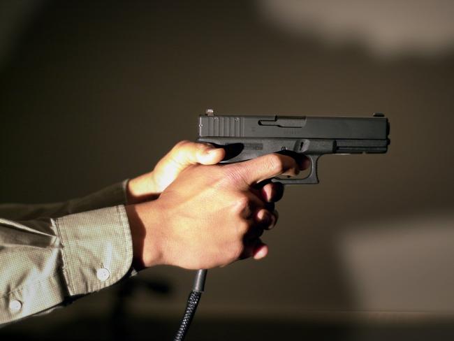 386019 08: An FBI Special Agent holds a gun wired to the agency's interactive Firearms Training System during a demonstration of the system February 26, 2001 in Los Angeles, CA. To simulate reality, subjects may succesfully run and shoot at officers for up to 20 seconds after being mortally wounded. The program trains agents in life threatening situations requiring split-second reactions. The program tallies lethal and non-lethal shots, misses, shots to friendly subjects, and also allows the suspects to shoot and kill the trainee in the simulation. (Photo by David McNew/Newsmakers)