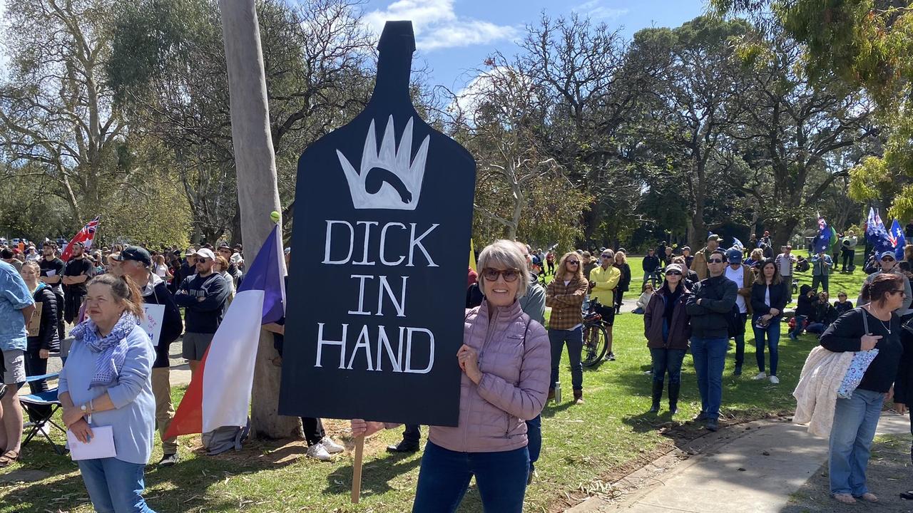 A woman holds a sign apparently referencing a decision by Bird in Hand winery to deny unvaccinated customers entry. Picture: Kathryn Birmingham