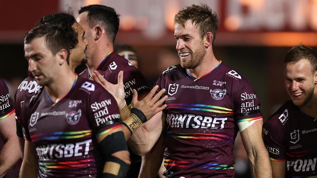 Andrew Davey celebrates with teammates after scoring a try in their loss to the Roosters last week.