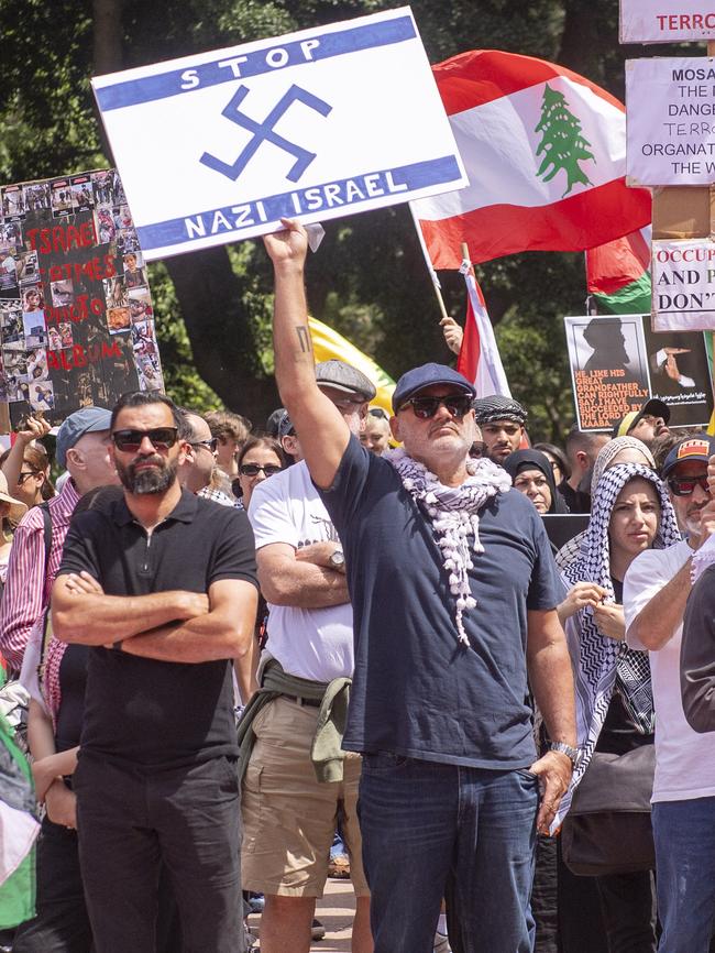 Mr Yazbek holding the Nazi sign on Sunday. Picture: Jeremy Piper