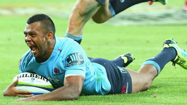 Kurtley Beale of the Waratahs scores against the Rebels.