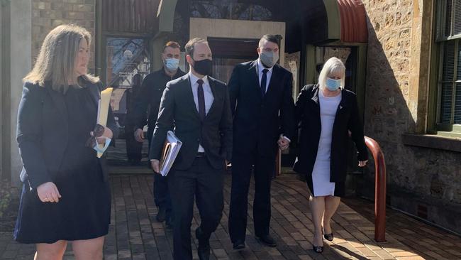 Campbell Henderson (second from the right), surrounded by supporters and his lawyers while leaving Mount Barker District Court on Wednesday after pleading guilty to drinking driving and causing the death of Nick Peart. Picture: Lydia Kellner