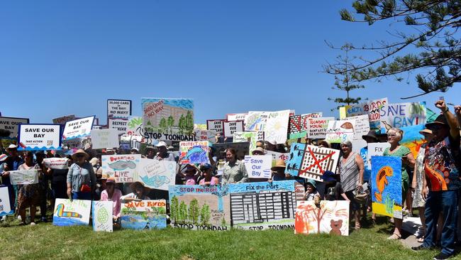 World Wetland Day visitors show off their artistic skills with new signs opposing the proposed Toondah Harbour mega development at the 2020 Word Wetlands Day event at the site.