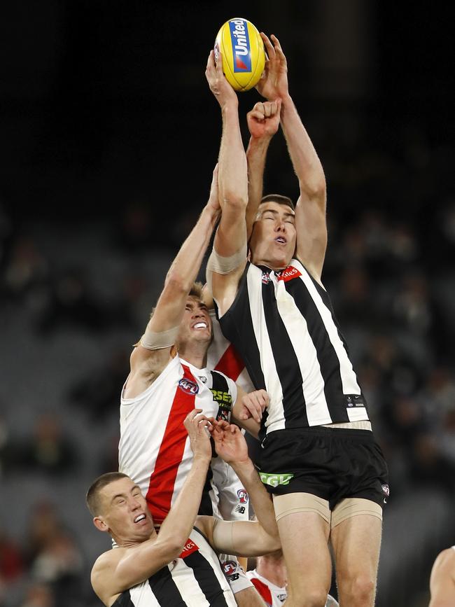 Mason Cox flies for a mark. Picture: Dylan Burns/AFL Photos via Getty Images