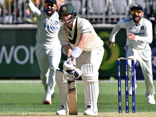 Steve Smith was again caught in an awkward position. Picture: Saeed Khan / AFP