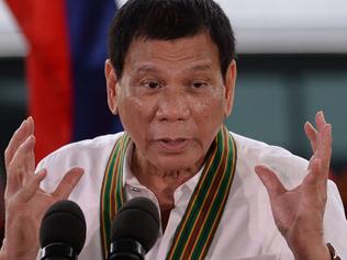 Philippine President Rodrigo Duterte gestures as he delivers a speech during a 