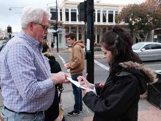 Vietnam veteran Carl Kuhn is collecting signatures for a petition to have the Milne Bay Military Museum building and land gifted to the community. Pictured here with Indo Wilson. Picture: Matthew Newton