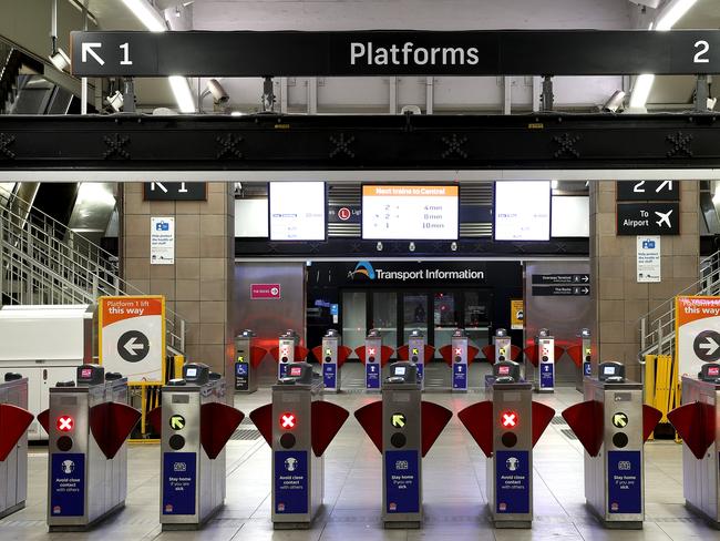 WEEKEND TELEGRAPHS SPECIAL - SPEAK TO PICTURE EDITOR JEFF DARMANIN BEFORE USE - Usually busy spots around Sydney are eerily quiet due to the current Covid 19 outbreak locking Sydney down for 2 months. Circular Quay train station is quiet on a Friday night. Picture: Toby Zerna