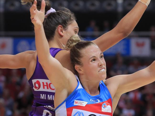 SYDNEY, AUSTRALIA - AUGUST 24: Paige Hadley of the Swifts competes for the ball with Jemma Mi Mi of the Firebirds during the round 14 Super Netball match between the New South Wales Swifts and Queensland Firebirds at Qudos Bank Arena on August 24, 2019 in Sydney, Australia. (Photo by Mark Evans/Getty Images)