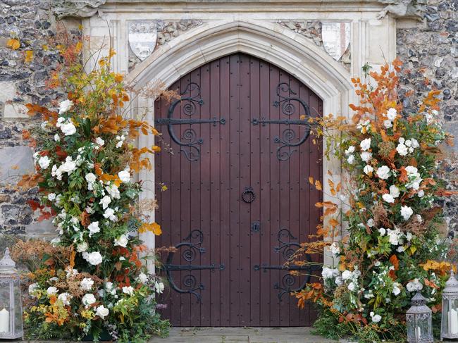 Flowers were arranged outside the church doors. Picture: W8Media / MEGA TheMegaAgency.com