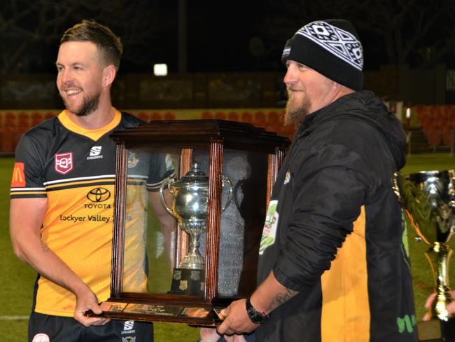 Gatton's captain Haydan Lipp and coach Jonathan Flint celebrating the win.