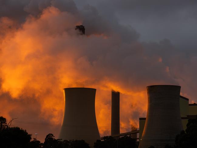 TRARALGON, AUSTRALIA - AUGUST 17: A general view of the Loy Yang power plants as the sun rises on August 17, 2022 in Traralgon, Australia. The Greens will introduce a bill to state parliament this week proposing the closure of Victoria's remaining coal plants - Yallourn, Loy Yang A, and Loy Yang B - by 2030 ahead of the current plan for decommissioning by 2046. (Photo by Asanka Ratnayake/Getty Images)