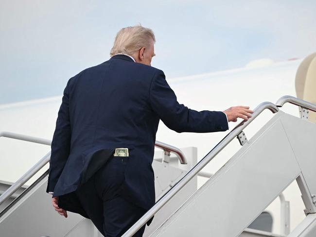 A fifty-dollar bill is seen in Donald Trump's back pocket as he travels to Alabama to give a commencement address before spending the weekend in Florida. Picture: AFP