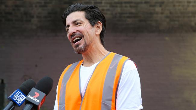 Renowned street artist Sid Tapia who has created the mural to honour Resilience NSW Commissioner Fitzsimmons, and the efforts of RFS volunteers throughout the Black Summer. Picture: NCA NewsWire / Gaye Gerard