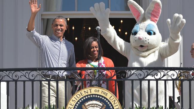 US President Barack Obama, First Lady Michelle Obama and the "Easter Bunny" arrive on the balcony for the start for the annual Easter egg roll on the South Lawn of the White House on April 6, 2015 in Washington, DC.