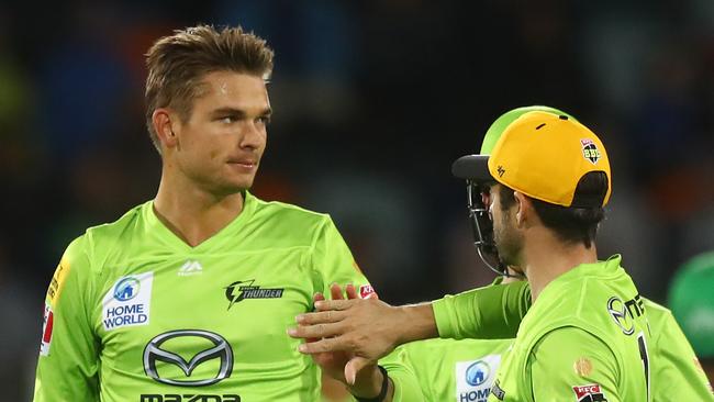 CANBERRA, AUSTRALIA - DECEMBER 29: Chris Green of the Thunder celebrates with Callum Ferguson of the Thunder after dismissing Ben Dunk of the Stars during the Big Bash League match between Sydney Thunder and the Melbourne Stars at Manuka Oval, on December 29, 2020, in Canberra, Australia. (Photo by Mike Owen/Getty Images)