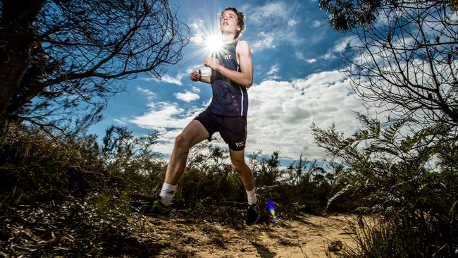 Cross country runner Thomas Delves enjoys the sights of Langwarrin Flora and Fauna Reserve. Picture Stuart Walmsley