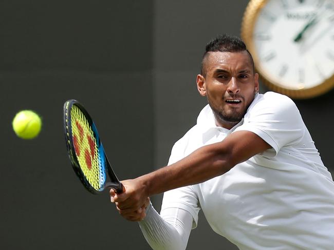 Australia's Nick Kyrgios returns the ball to Australia's Jordan Thompson during their men's singles first round match on the second day of the 2019 Wimbledon Championships at The All England Lawn Tennis Club in Wimbledon, southwest London, on July 2, 2019. (Photo by Adrian DENNIS / AFP) / RESTRICTED TO EDITORIAL USE