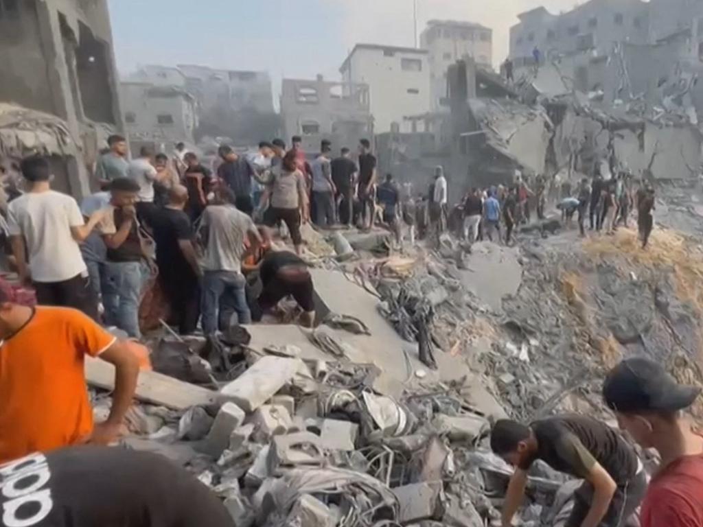 Palestinians looking for survivors after the strike on the Jabalia refuge camp. Picture: AFP