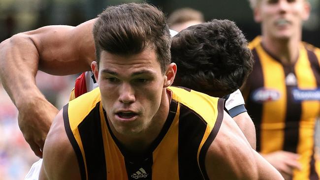 Jaeger O'Meara tackled by Charlie Cameron Picture: Wayne Ludbey