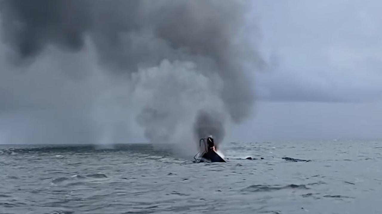 Authorities waited for the yacht to fully submerge before leaving the scene. Picture: Supplied/Queensland Police