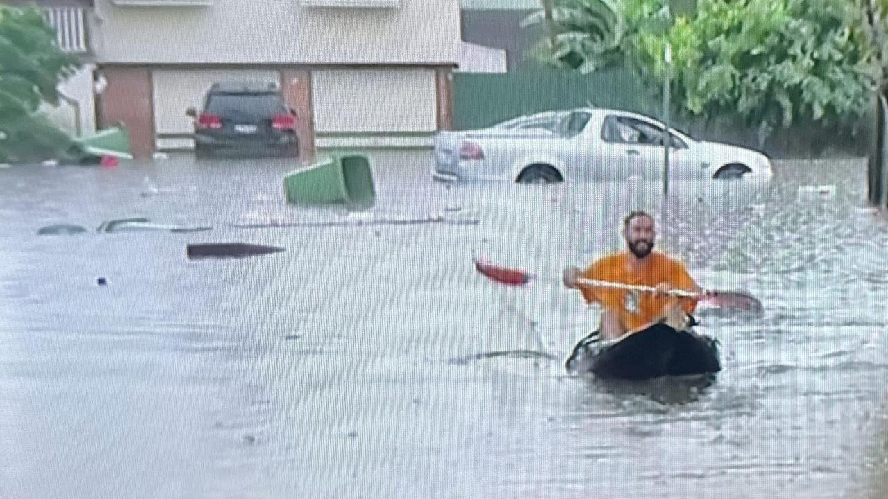 Residents have reverted to alternative modes of transport after 300mm of rain fell over parts of South East Queensland overnight. Picture: QAS