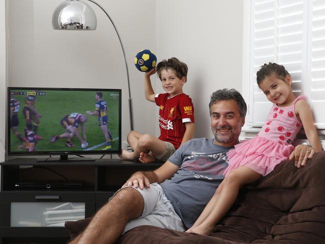 The sports-starved British family were happy to see a game on TV, even if they didn’t understand all of the rules. Picture: Hollie Adams